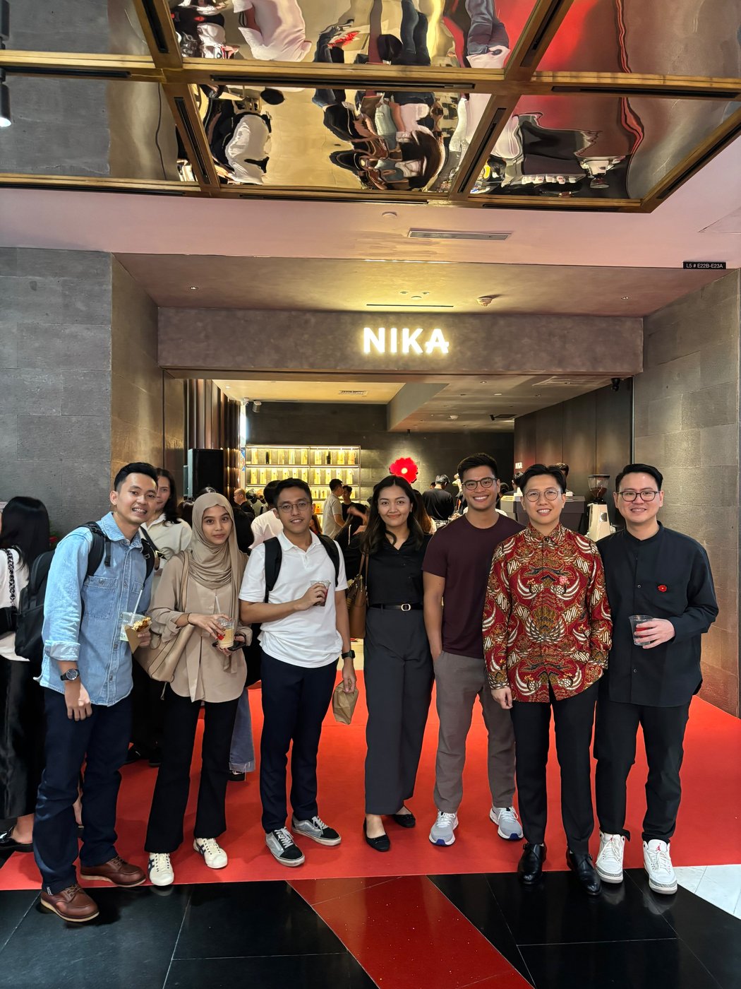 AKRUA team celebrating with a client at a store opening