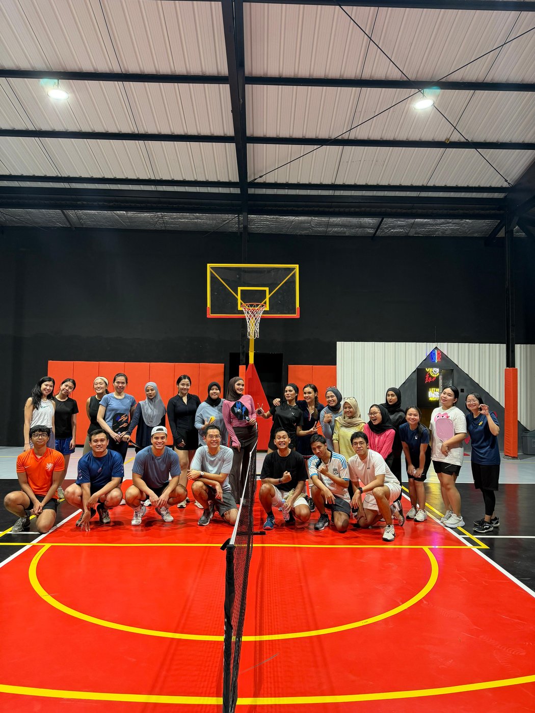 The AKRUA team at a sport outing, playing badminton and basketball